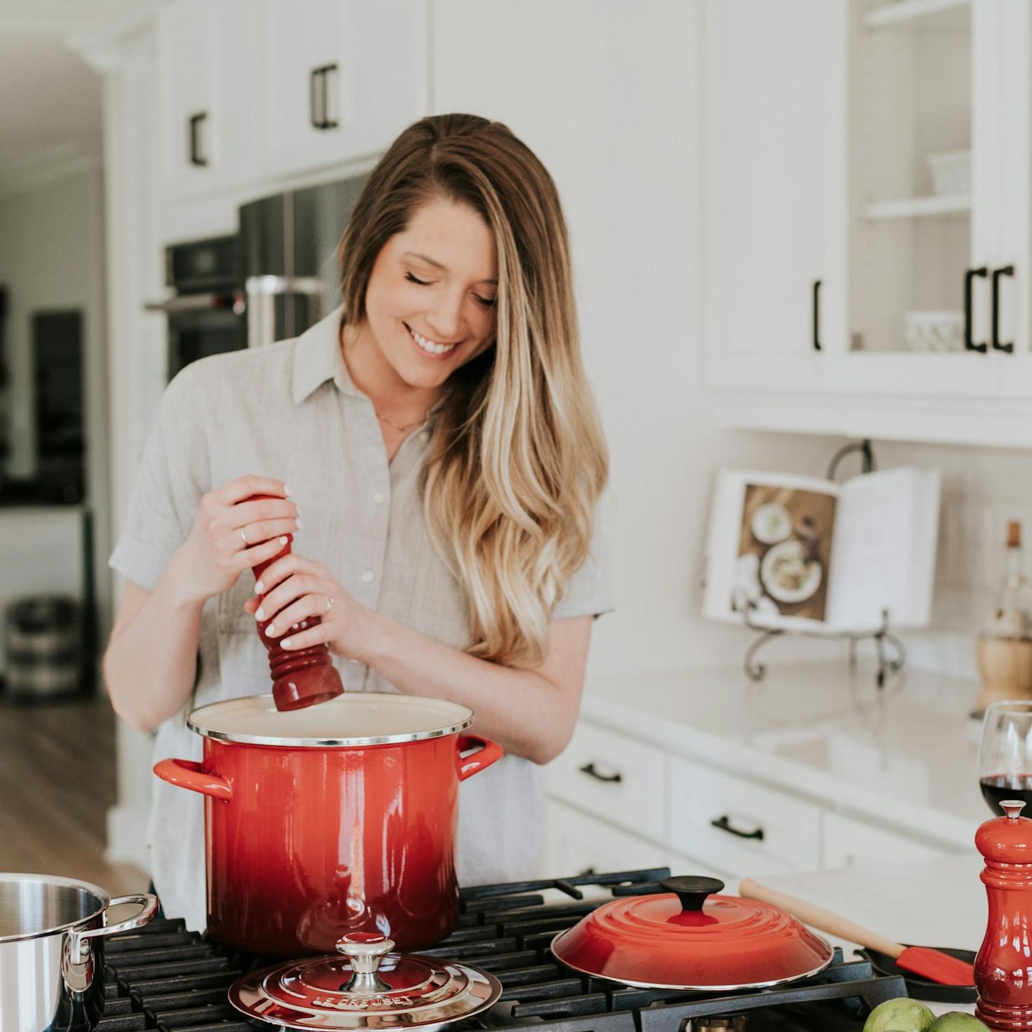 Community members collaborating in a modern kitchen space, sharing recipes and cooking techniques